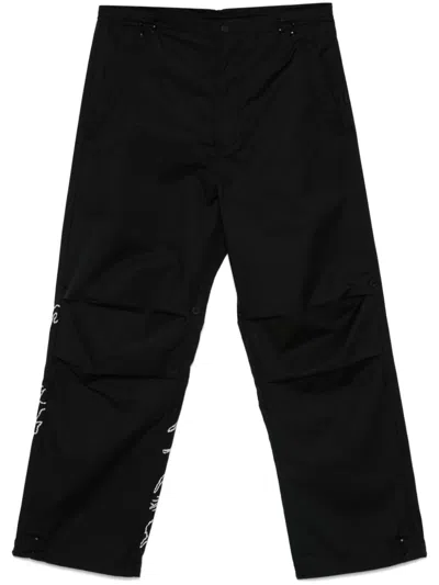Maharishi Maha Basquiat Trousers In Black
