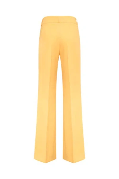 Maison Common Travel Save Boot Cut Trousers In Yellow