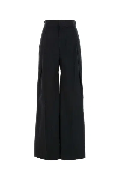 Maison Margiela Four-stitch Logo Palazzo Trousers In Black