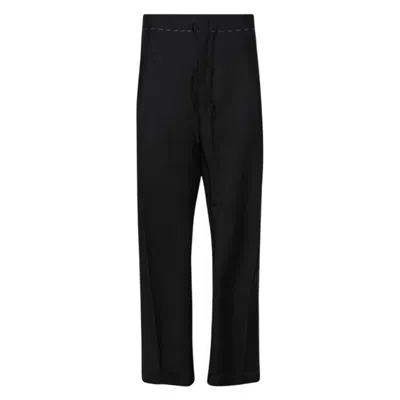 Maison Margiela Creased Stitch Detailed Trousers In Black