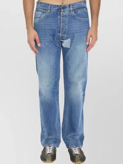 MAISON MARGIELA DENIM TROUSERS FEATURING FRONT PATCH