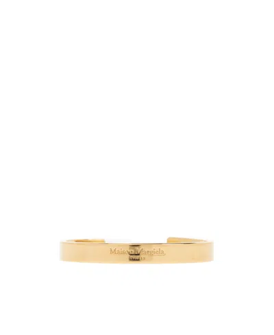 Maison Margiela Logo Engraved Bangle Bracelet In Yellow