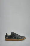 Maison Margiela Replica Sneakers Made Of Shiny Coated Leather In Black