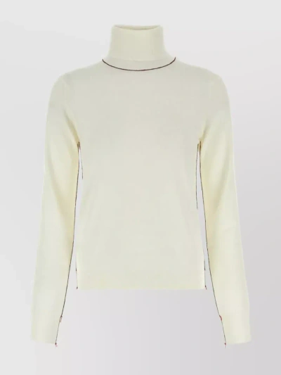 MAISON MARGIELA STREAMLINED WOOL TURTLENECK WITH DÉCORTIQUÉ TRIMMINGS
