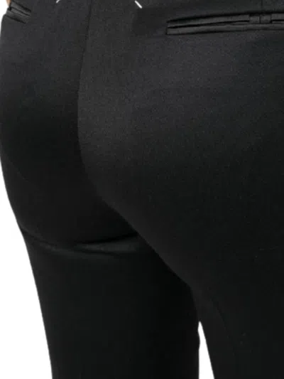 Maison Margiela Tailored Flared Trousers With Structured Hem In Black