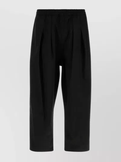 MAISON MARGIELA TAILORED TWILL TROUSERS FEATURING PLEATED FRONT