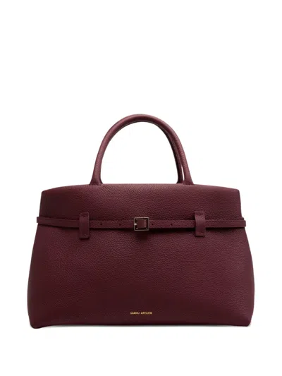 Manu Atelier Buckle-strap Hammered Leather Bag In Red