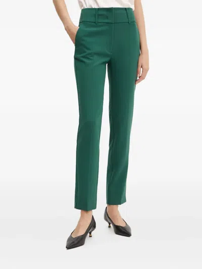 Marciano Logo-plaque Trousers In Green