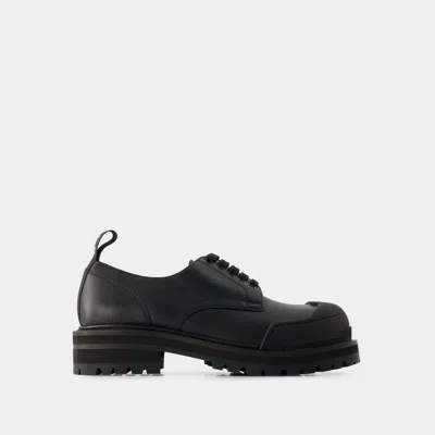 Marni Dada Rubber-trimmed Leather Brogues In Black