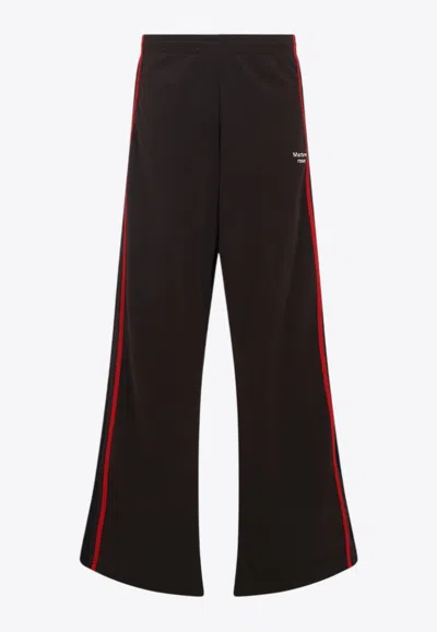 MARTINE ROSE WIDE-LEG TRACK PANTS