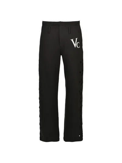 Masu Heart-hole Logo-print Track Pants In Black