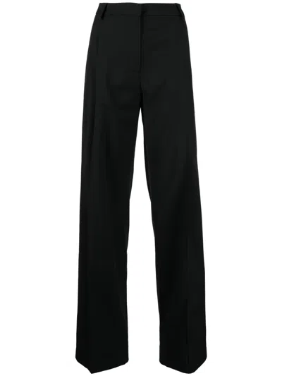 Materiel Wide-leg Pleated Trousers In Black