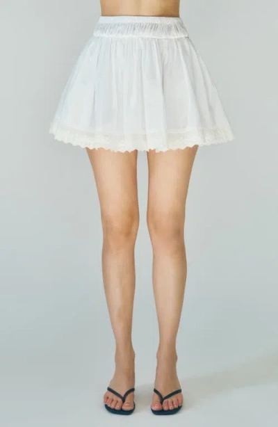 Maude Club Austin Embroidered Hem Cotton Miniskirt In White