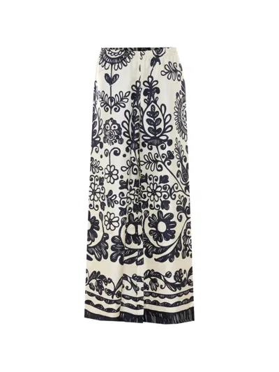 Maurizio Pecoraro Floral-print Trousers In Neutral