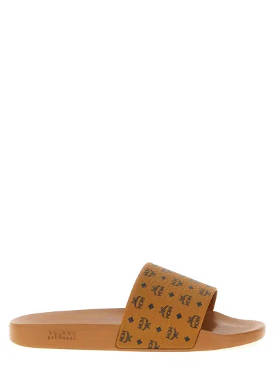 Mcm Male Monogram Print Rubber Slides In Brown