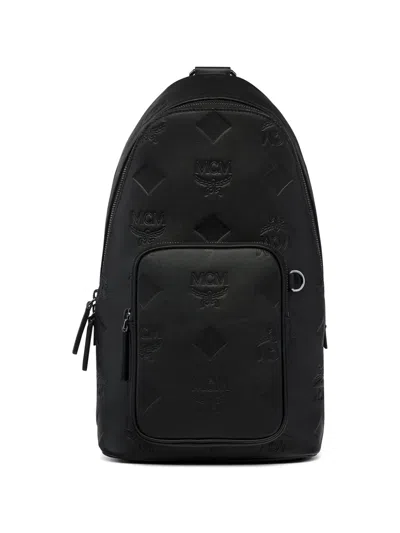 Mcm Aren Embossed Monogram Messenger Bag In Black