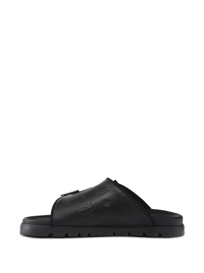 Mcm Embossed Monogram Leather Sandals In Black