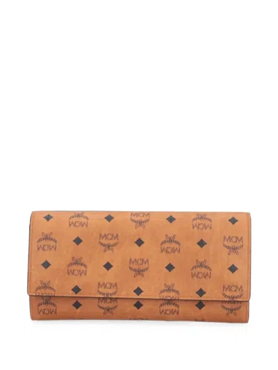 Mcm Large Aren Monogram-print Flap Wallet In Brown