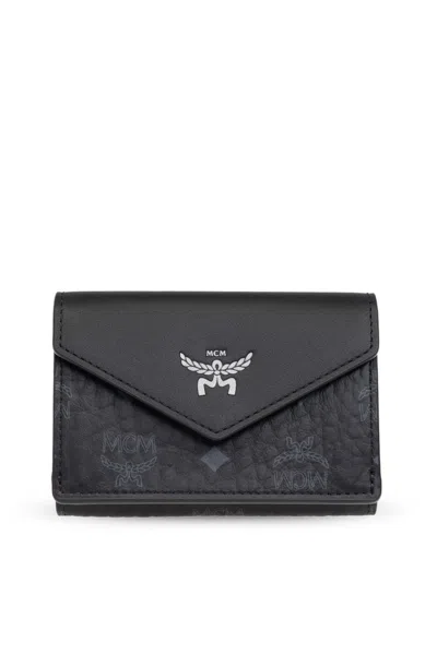 Mcm Logo Embossed Foldover Wallet In Black