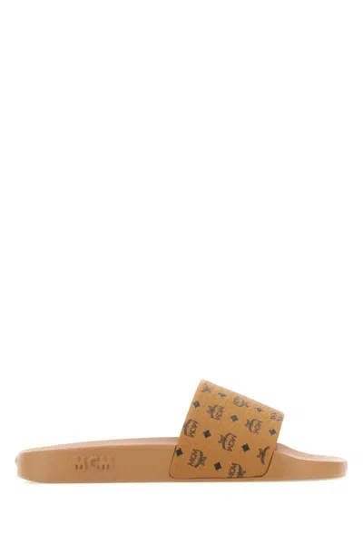Mcm Male Monogram Print Rubber Slides In Brown