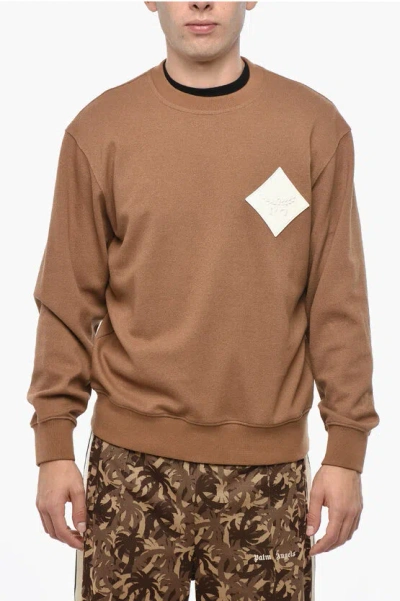 MCM SOLID COLOR CREW-NECK SWEATSHIRT WITH LOGO PATCH ON THE FRON