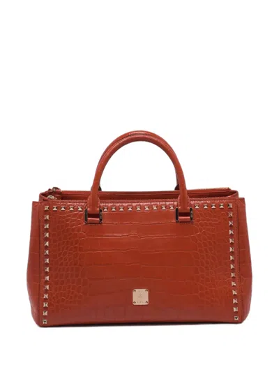 Pre-owned Mcm Studded Crocodile-embossed Tote Bag In Red