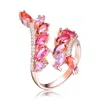 MEGAN WALFORD MEGAN WALFORD STERLING SILVER WITH ROSE PLATED REDCUBIC ZIRCONIA BYPASS RING