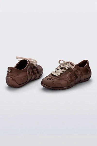 Melissa Motion Jelly Sneaker In Copper, Women's At Urban Outfitters In Brown