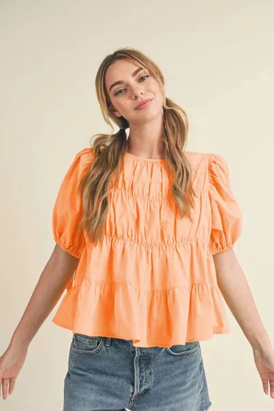 Merci Tayler Tiered Shirring Puff Sleeve Top In Peach Fuzz In Orange