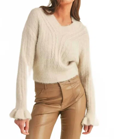 Merci Woven Knit Sweater With Flutter Cuff In Ivory In White