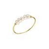 Mg Jewelry Women's Gold / White Petite Pearl Waterproof Ring In Gold