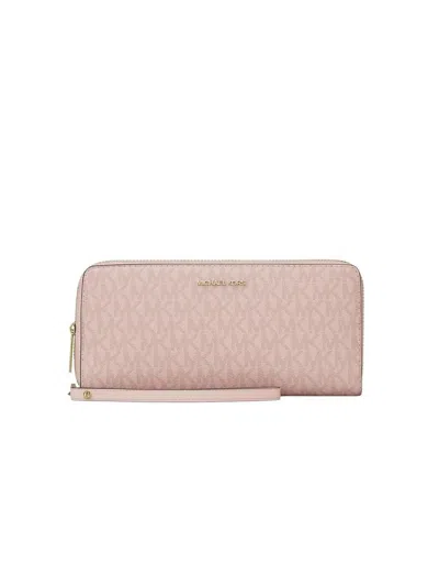Michael Kors Coated Monogram Canvas Travel Wallet In Pink