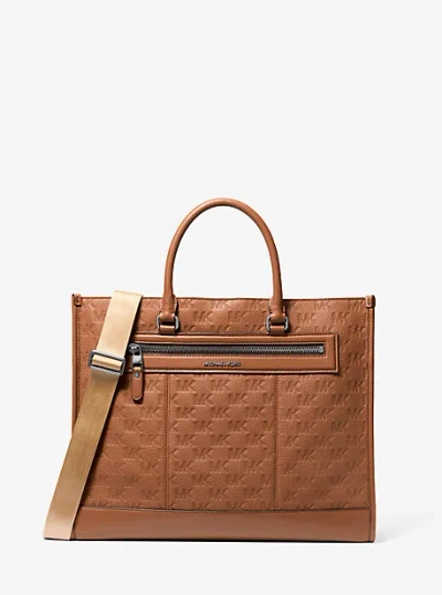 Michael Kors Jet Set Logo Embossed Leather Tote Bag In Brown