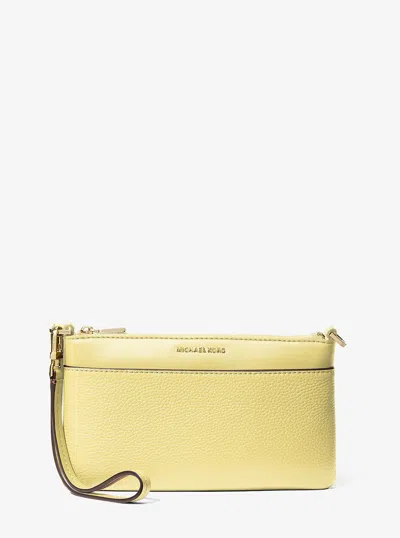 Michael Kors Jet Set Medium Pebbled Leather Wristlet In Yellow