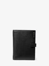 Michael Kors Jet Set Pebbled Leather Passport Wallet In Black