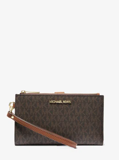 Michael Kors Jet Set Travel Signature Logo Smartphone Wallet In Brown