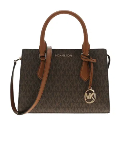 Michael Kors Logo Pendant Shoulder Bag In Brown