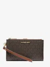 Michael Kors Outlet Jet Set Travel Signature Logo Smartphone Wallet In Brown