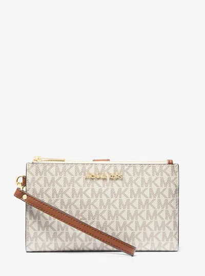 Michael Kors Outlet Jet Set Travel Signature Logo Smartphone Wallet In Pattern