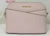 Michael Kors Jet Set Travel Medium Leather X Cross Dome Crossbody Handbag Powder Blush Solid In Multi