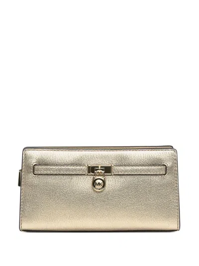 Michael Michael Kors Hamilton Lock-detail Metallic Leather Clutch In Yellow