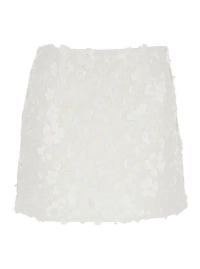 MICHAEL MICHAEL KORS MINI SKIRT WITH FLORAL APPLIQUÉS