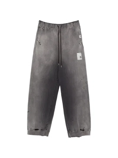 Miharayasuhiro Distressed Logo-print Track Pants In Animal Print