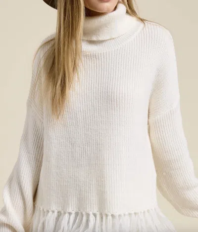 Mimosa Fringe Hem Ribbed Turtleneck Sweater In Cream In White