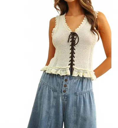 Miou Muse Lace Up Front Knit Top With Ruffled Hem In Cream/brown In Multi