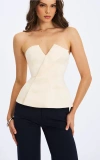 Miss Circle Yani Asymmetrical Lapel Sleeveless Peplum Top In White