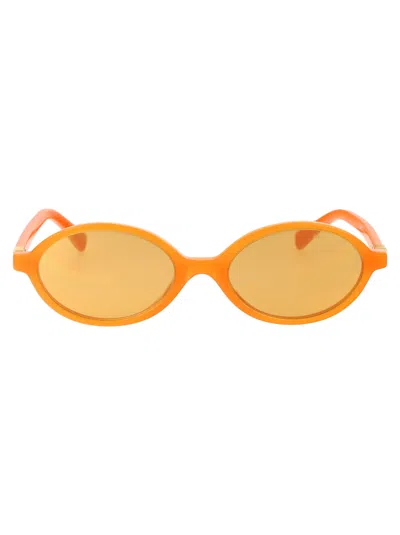 Miu Miu 0mu 04zs Sunglasses In 11v40d Turmenic Opal