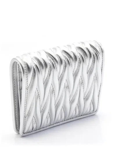 Pre-owned Miu Miu 2010-2025 Metallic Matelasse Wallet Small Wallets In Silver