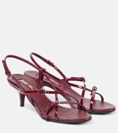 MIU MIU 55 PATENT LEATHER SANDALS