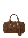 Miu Miu Arcadie Puffed Leather Bowling Bag In Braun